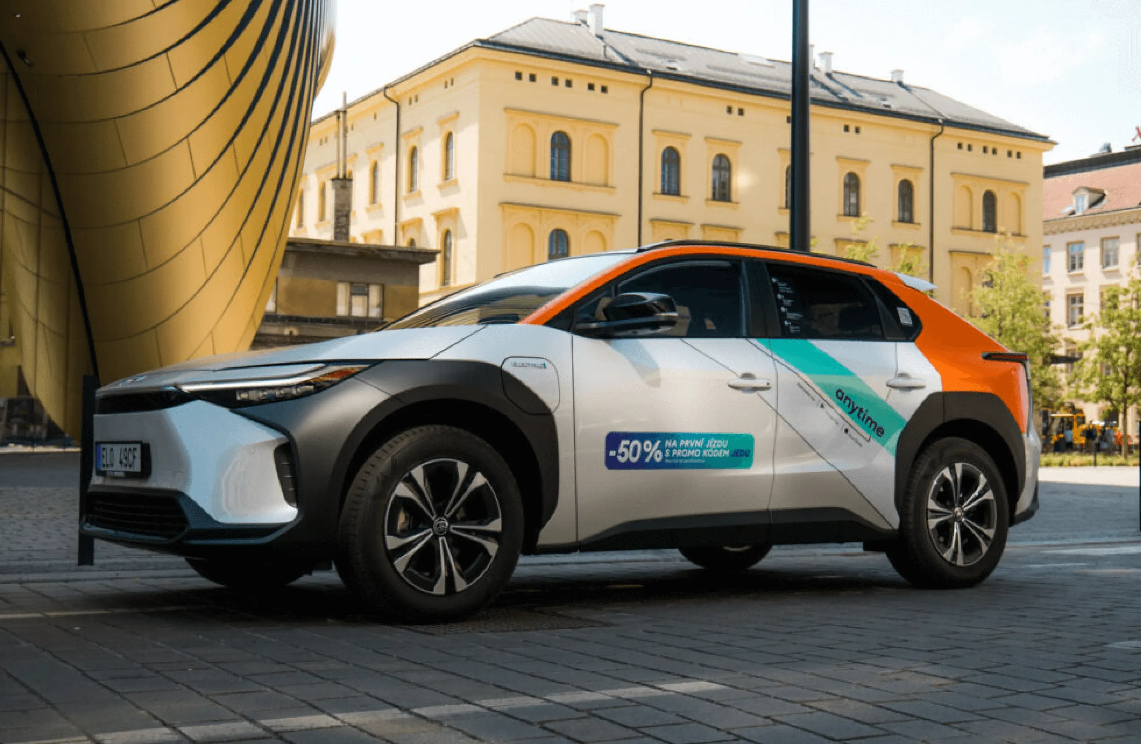Anytime CZ eco-friendly car-sharing vehicle parked in Prague, highlighting the service's success with 600,000+ rentals since 2019